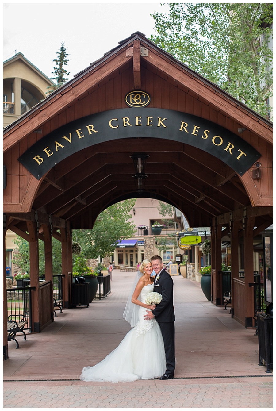 Romantic Beaver Creek Wedding Bride and Groom on covered bridge in Beaver Creek wedding