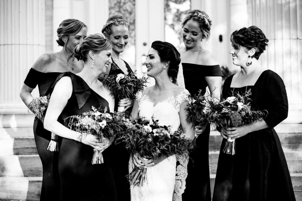 Bride laughing with bridesmaids at Grant Humphries mansion