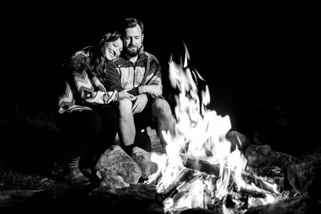 camping engagement photos by campfire