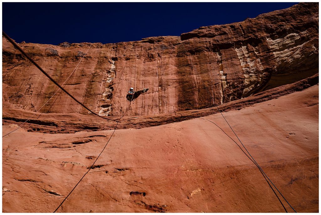Repelling photo into canyon.