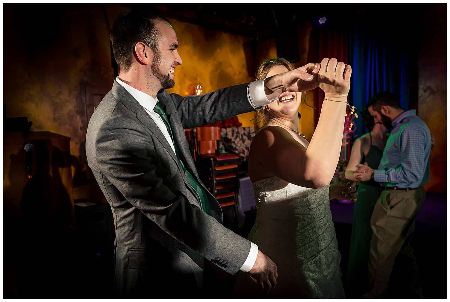 Candid dancing photos at wedding reception in Denver